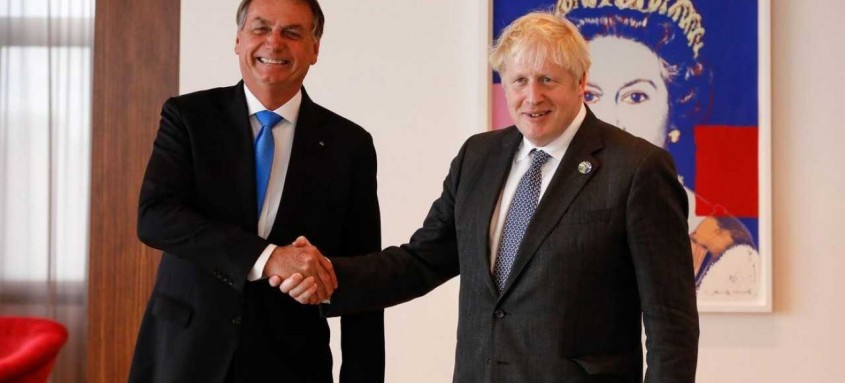  Presidente Jair Bolsonaro cumprimenta o primeiro-ministro do Reino Unido, Boris Johnson, em encontro bilateral